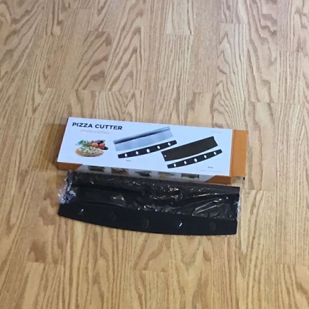 New stock, black pizza cutters with blade cover